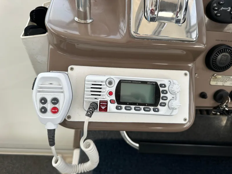 Slide: The Image of 2005 Regal 4260 COMMODORE boat radio and control panel close-up. - 28