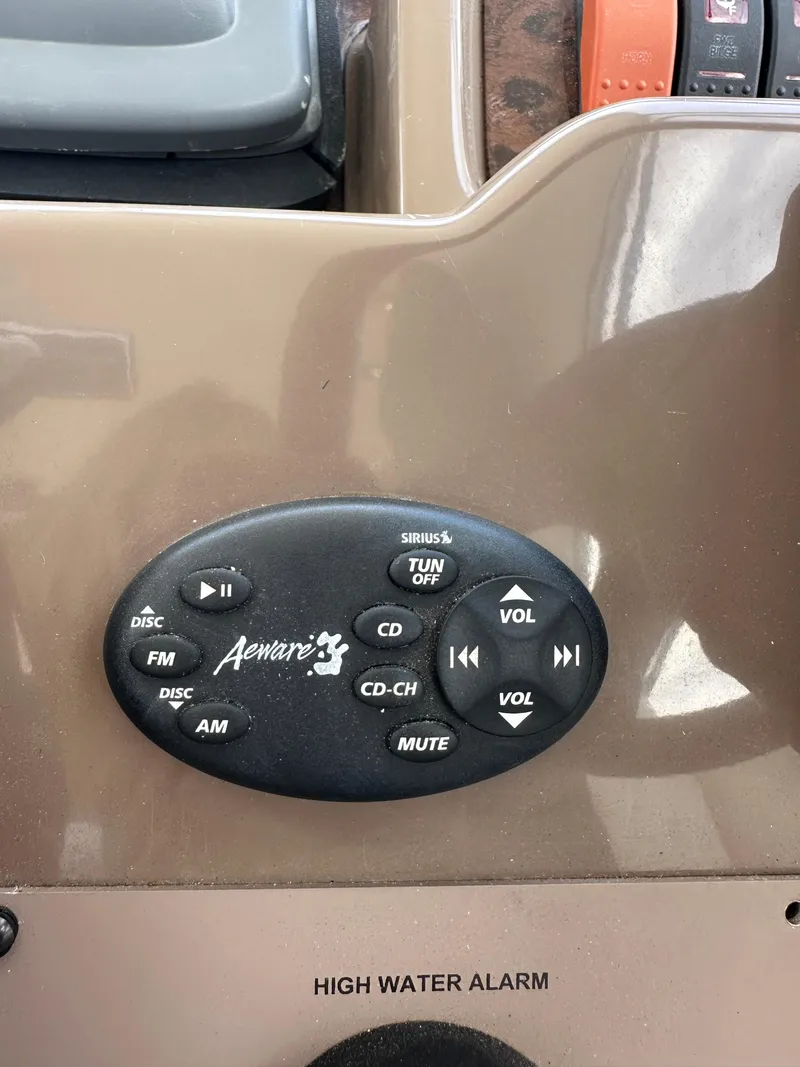 Slide: The Image of Control panel of a 2005 Regal 4260 COMMODORE boat with audio and alarm features. - 30