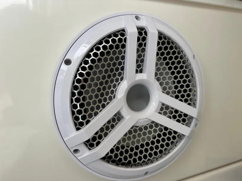 Slide: The Image of Close-up of a white speaker grille on a 2005 Regal 4260 COMMODORE boat. - 32