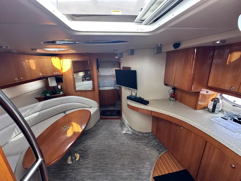 Slide: The Image of Luxurious interior of a 2005 Regal 4260 Commodore yacht with elegant wood finishes. - 33