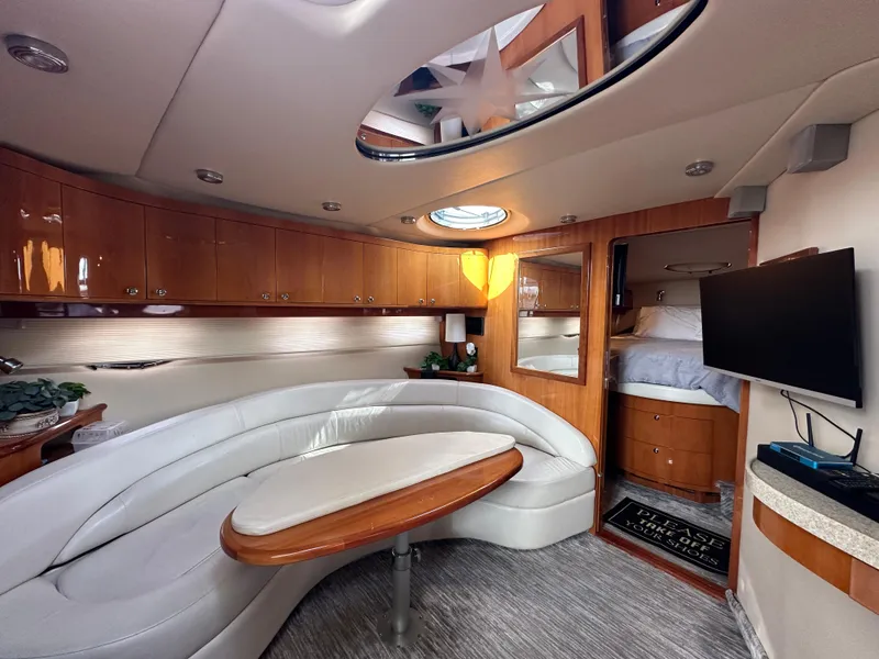Slide: The Image of Luxurious interior of 2005 Regal 4260 Commodore yacht with elegant seating and modern amenities. - 34