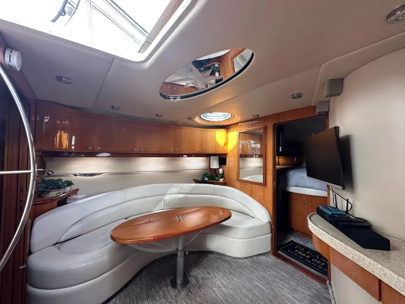 Slide: The Image of Luxurious interior of a 2005 Regal 4260 Commodore yacht with elegant seating and modern amenities. - 35