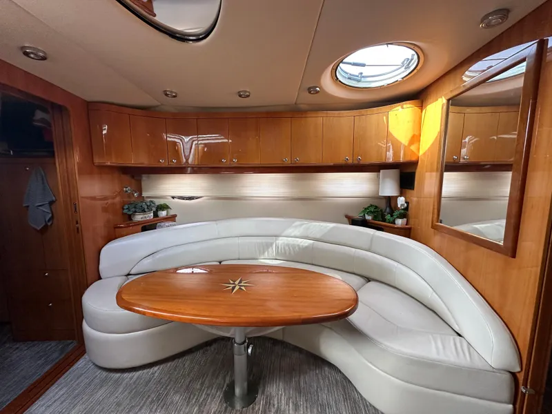 Slide: The Image of Luxurious interior of 2005 Regal 4260 COMMODORE yacht with elegant seating and wooden table. - 36