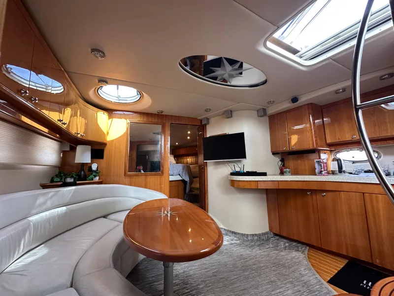 Slide: The Image of Luxurious interior of 2005 Regal 4260 COMMODORE yacht with elegant wood finishes and modern amenities. - 37