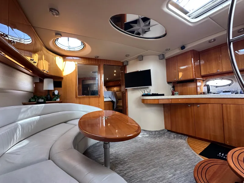 Slide: The Image of Luxurious interior of a 2005 Regal 4260 Commodore yacht with elegant wood finishes. - 39