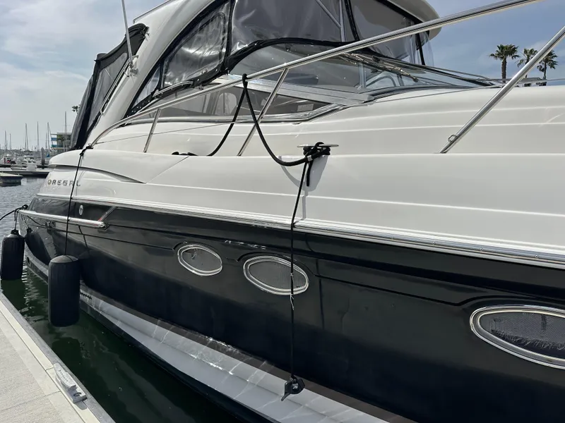 Slide: The Image of 2005 Regal 4260 Commodore yacht docked at marina, side view. - 4