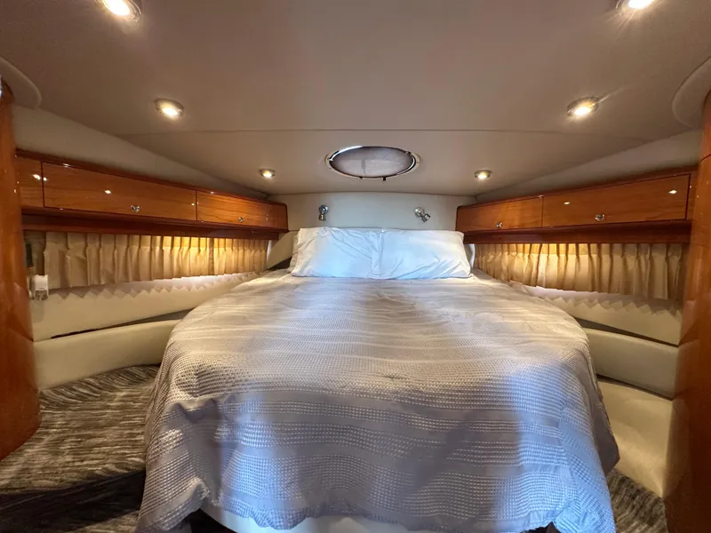 Slide: The Image of Luxurious cabin interior of 2005 Regal 4260 COMMODORE yacht with cozy bed and ambient lighting. - 42