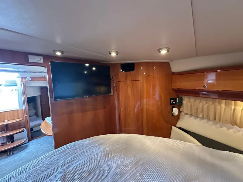 Slide: The Image of Luxurious interior of 2005 Regal 4260 Commodore yacht with wood paneling and modern amenities. - 44