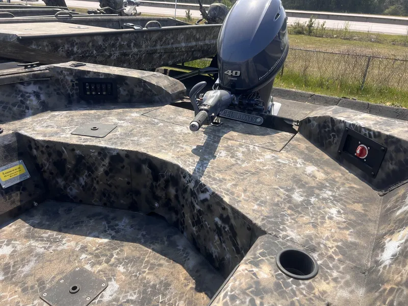 Slide: The Image of 2024 Excel RIVER WARRIOR 1651 boat with Yamaha 40 engine, camo design. - 5