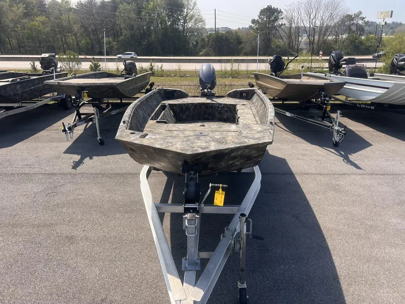 Slide: The Image of 2024 Excel RIVER WARRIOR 1651 boat on trailer, parked outdoors. - 8