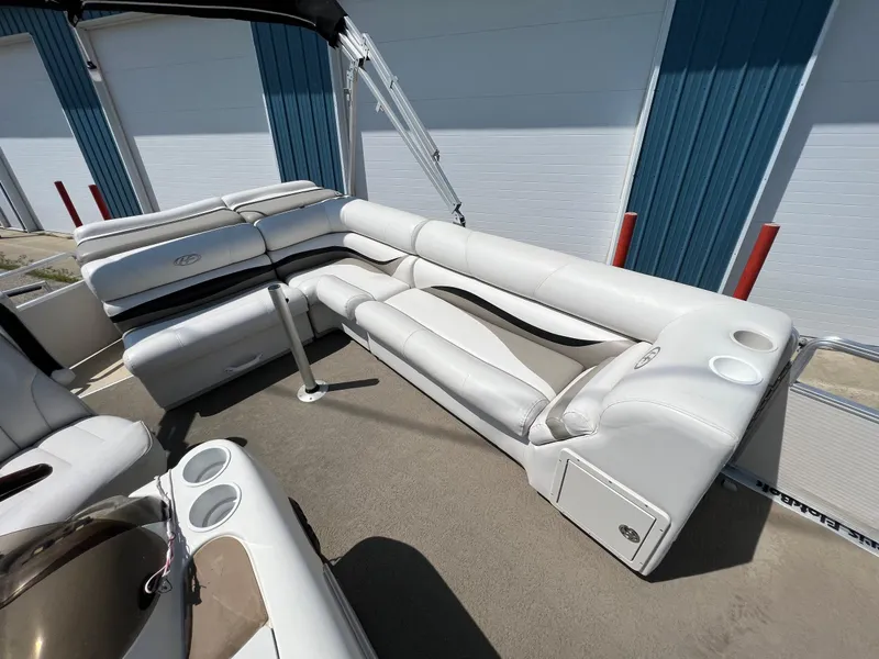 Slide: The Image of 2006 Harris FloteBote 250 Super Sunliner interior with white seating and cup holders. - 17