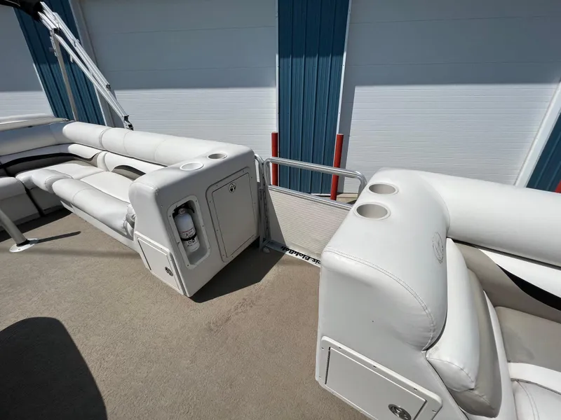 Slide: The Image of 2006 Harris FloteBote 250 Super Sunliner interior with white seating and cup holders. - 20