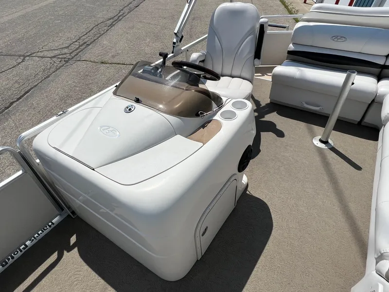 Slide: The Image of 2006 Harris FloteBote 250 Super Sunliner pontoon boat interior with helm and seating. - 9