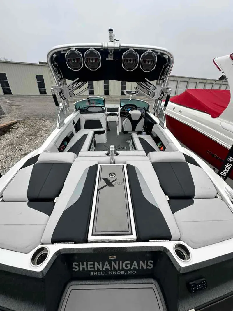Slide: The Image of 2020 MasterCraft XStar boat interior with sleek seating and audio system. - 4