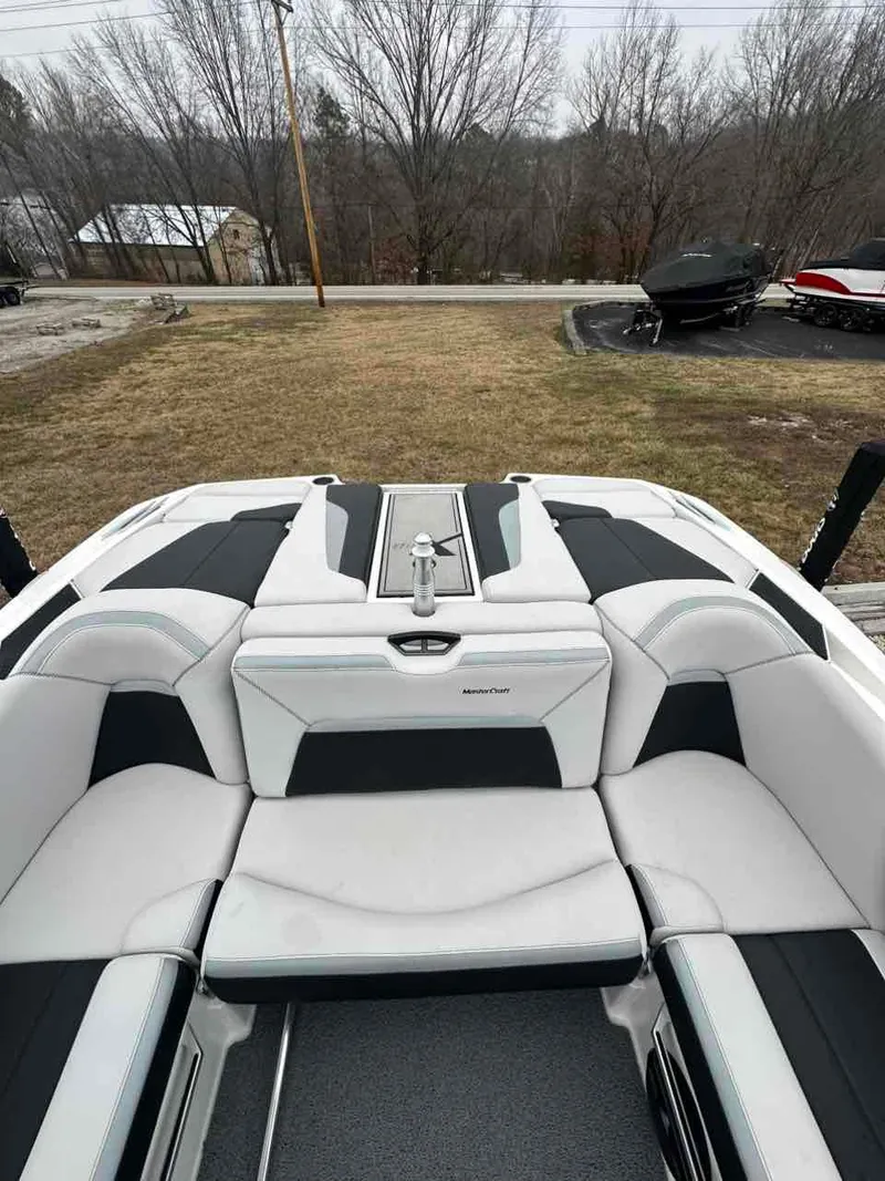 Slide: The Image of 2020 MasterCraft XStar boat interior with sleek white and black seating. - 5
