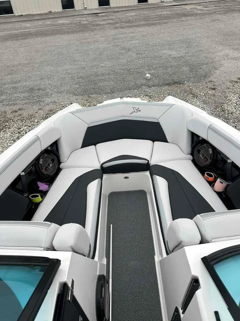 Slide: The Image of 2020 MasterCraft XStar boat interior with sleek seating and cup holders. - 9