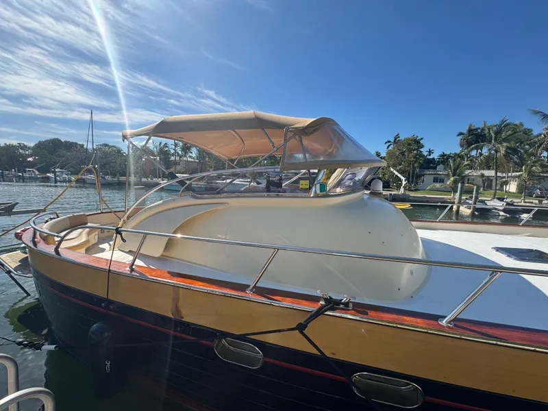 Slide: The Image of 2005 Apreamare Don Giovanni boat docked under clear blue sky. - 1