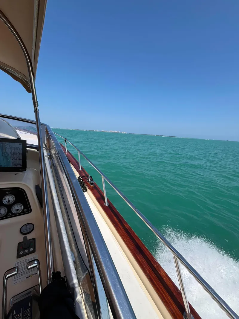 Slide: The Image of 2005 Apreamare Don Giovanni yacht cruising on turquoise waters under clear blue skies. - 10