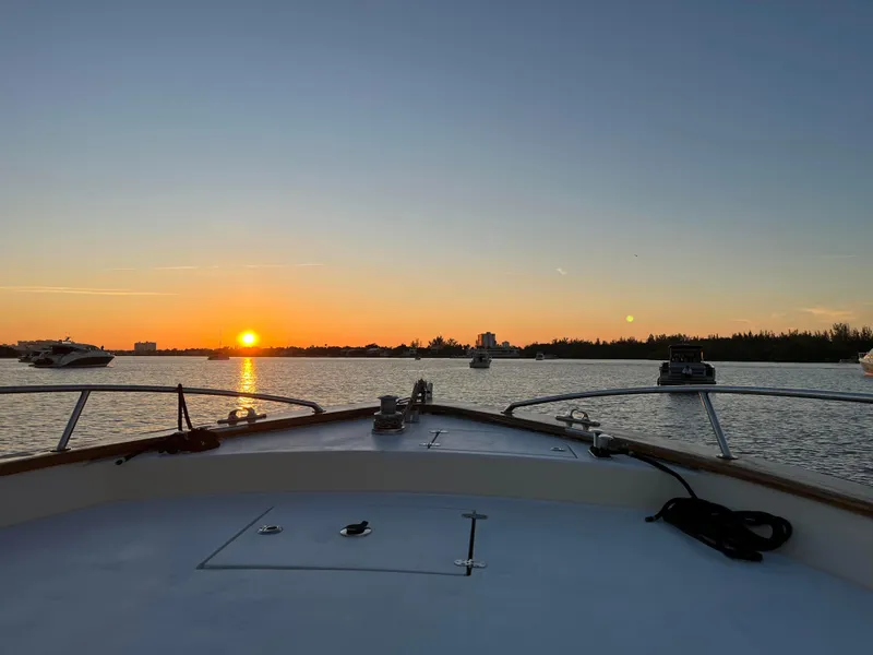 Slide: The Image of 2005 Apreamare Don Giovanni boat at sunset on calm waters. - 14