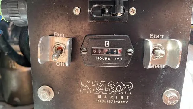 Slide: The Image of Control panel of a 2005 Apreamare Don Giovanni boat with hour meter and switches. - 16