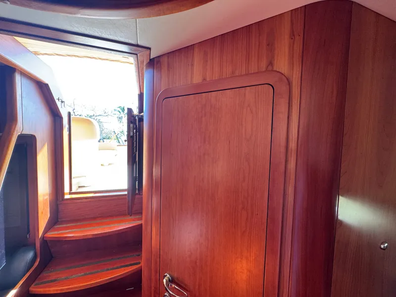 Slide: The Image of Interior of 2005 Apreamare Don Giovanni yacht with wooden paneling and stairs. - 25