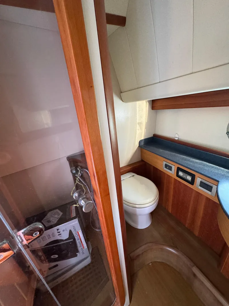 Slide: The Image of 2005 Apreamare Don Giovanni yacht bathroom with wooden accents and modern fixtures. - 29
