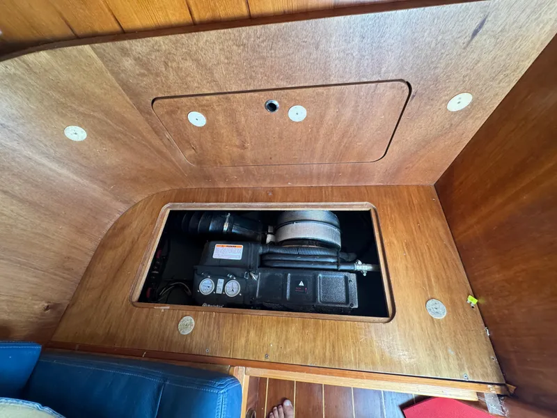 Slide: The Image of Engine compartment of a 2005 Apreamare Don Giovanni boat, featuring wooden paneling. - 35