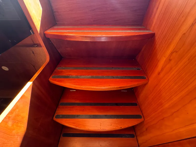 Slide: The Image of Wooden stairs inside a 2005 Apreamare Don Giovanni boat, featuring sleek design and craftsmanship. - 36