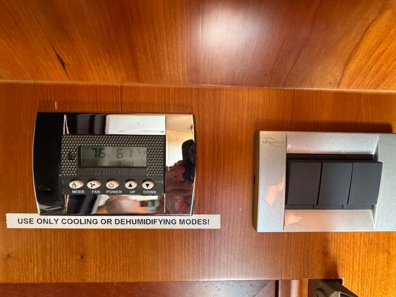 Slide: The Image of Thermostat and switch panel on 2005 Apreamare Don Giovanni boat interior. - 37