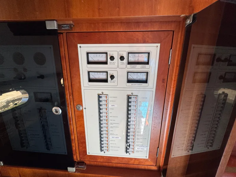 Slide: The Image of Electrical panel on a 2005 Apreamare Don Giovanni boat, featuring gauges and switches. - 38