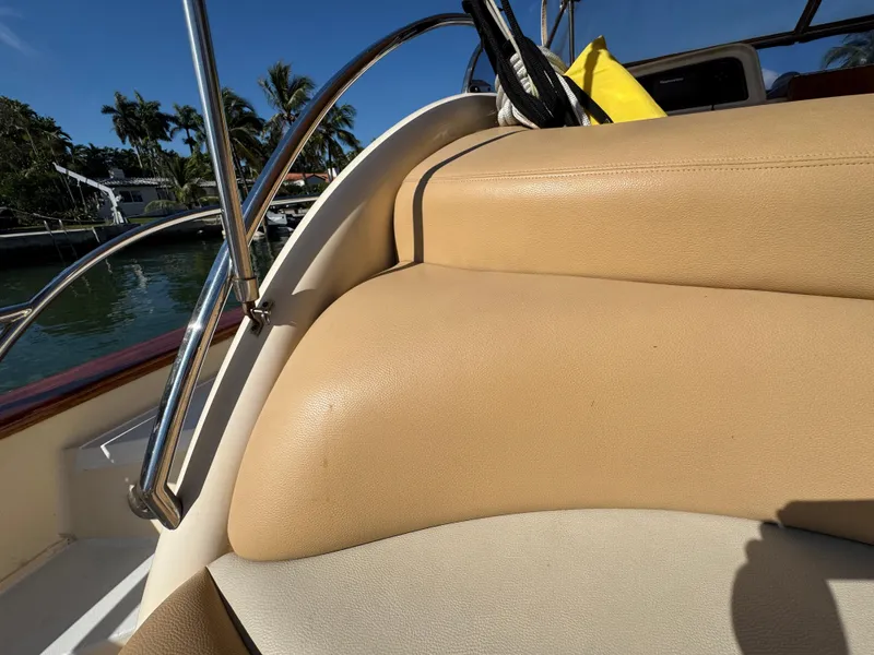 Slide: The Image of 2005 Apreamare Don Giovanni boat interior with tan leather seating and chrome railings. - 49