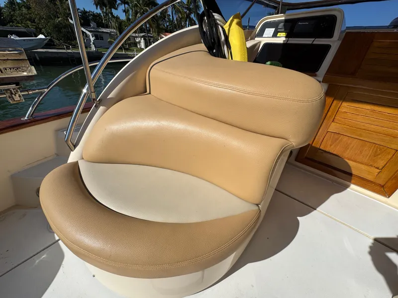 Slide: The Image of 2005 Apreamare Don Giovanni boat with tan leather seating in the cockpit area. - 7