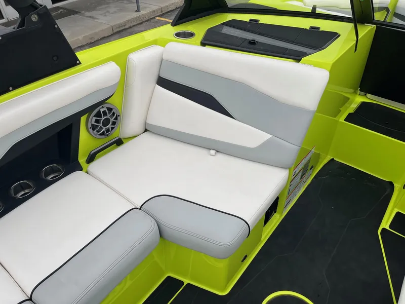 Slide: The Image of 2023 Axis T220 boat interior with lime green and white seating. - 26