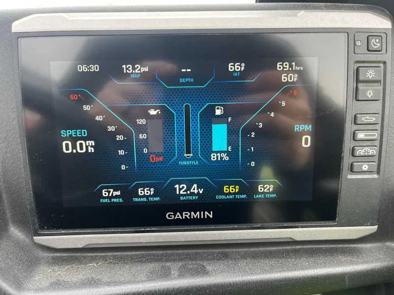Slide: The Image of Garmin display showing Axis T220 boat metrics: speed, RPM, fuel, and temperature. - 32