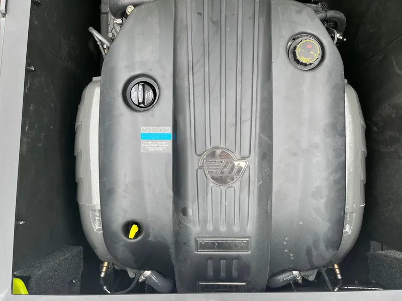 Slide: The Image of Engine compartment of a 2023 Axis T220 boat, featuring Monsoon engine components. - 36