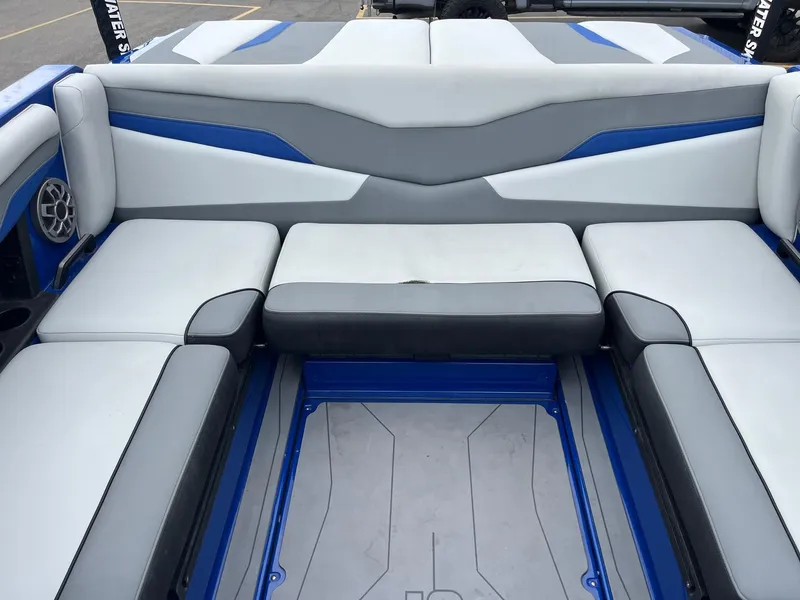 Slide: The Image of 2023 Axis T220 boat interior with gray and blue cushioned seating. - 19