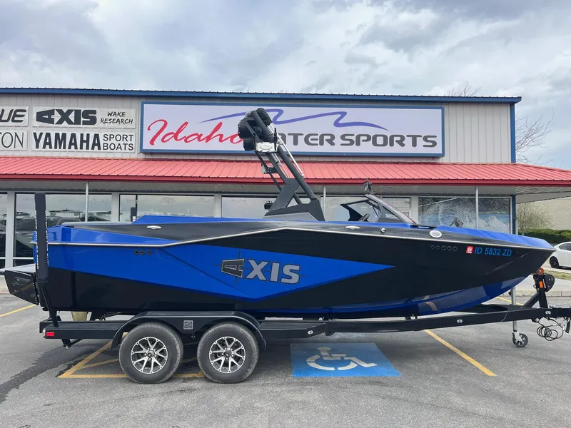Slide: The Image of 2023 Axis T220 boat on trailer at Idaho Water Sports dealership. - 3