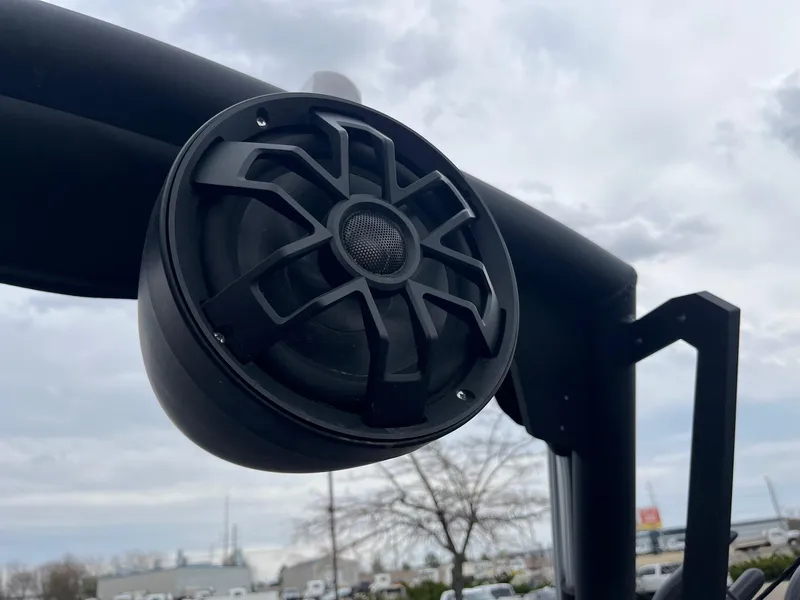 Slide: The Image of Close-up of a 2023 Axis T220 boat speaker against a cloudy sky. - 32