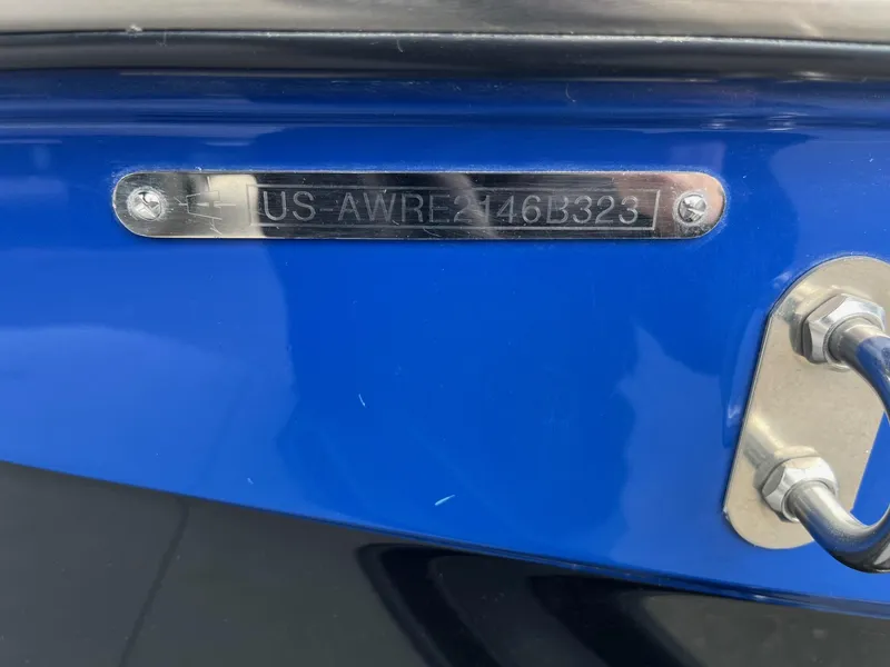 Slide: The Image of 2023 Axis T220 boat with visible hull identification number plate. - 37