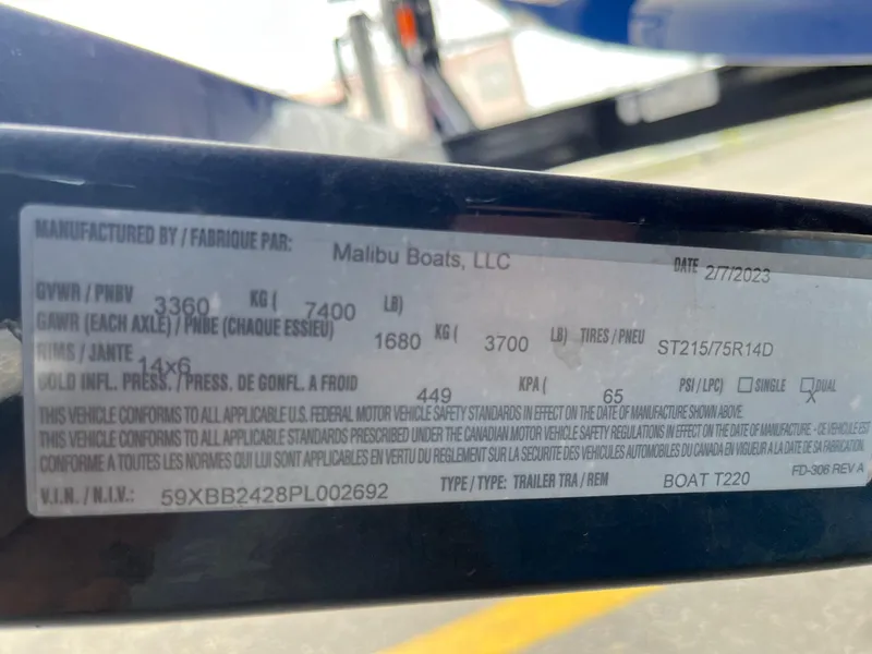 Slide: The Image of Label on Axis T220 boat trailer, manufactured by Malibu Boats, LLC, dated 2/7/2023. - 38