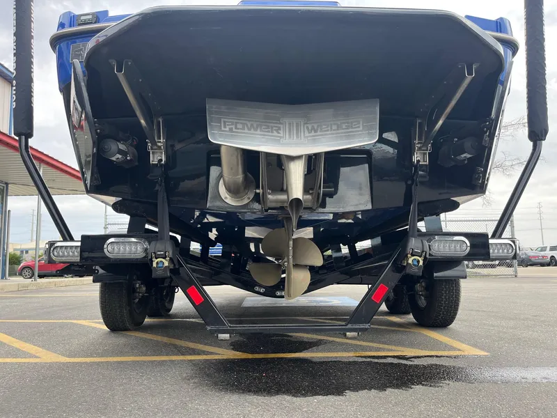 Slide: The Image of 2023 Axis T220 boat rear view showing propeller and Power Wedge III system. - 6