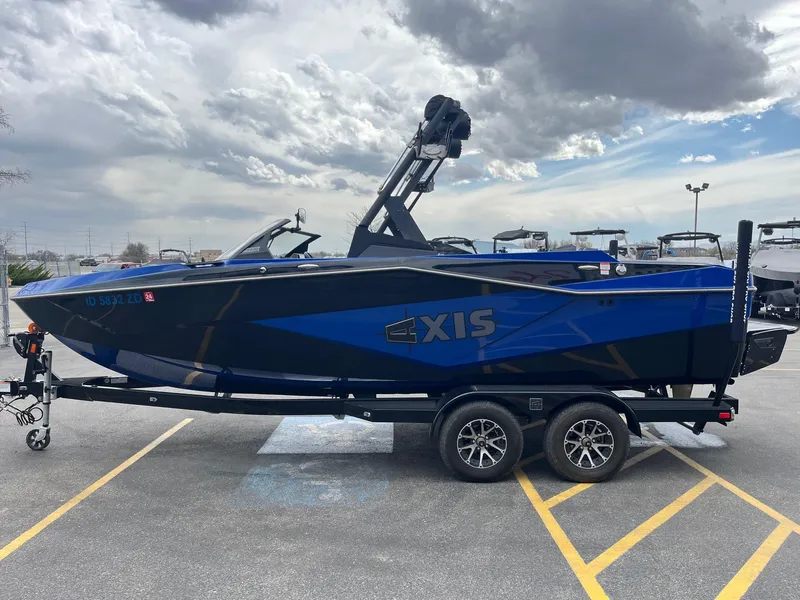 Slide: The Image of 2023 Axis T220 boat on trailer under cloudy sky. - 9