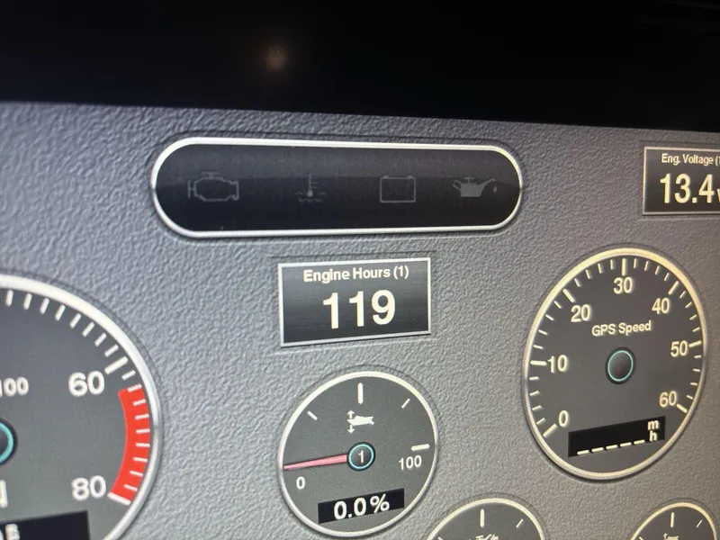 Slide: The Image of Dashboard of 2019 Chris-Craft Launch 28 GT showing engine hours and GPS speed. - 13