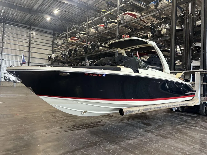 Slide: The Image of 2019 Chris-Craft Launch 28 GT boat in storage facility, side view. - 2