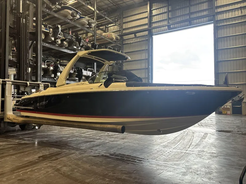 Slide: The Image of 2019 Chris-Craft Launch 28 GT boat in storage facility, side view. - 3