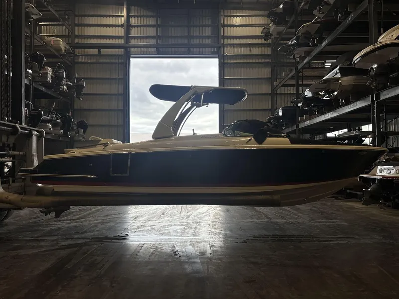 Slide: The Image of 2019 Chris-Craft Launch 28 GT boat in storage facility, side view. - 4
