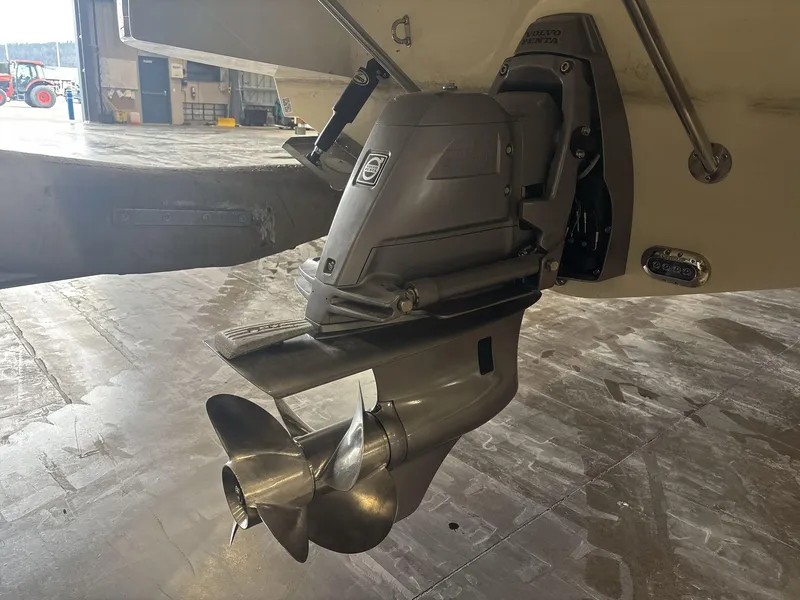 Slide: The Image of 2019 Chris-Craft Launch 28 GT boat propeller and stern drive in a garage setting. - 5