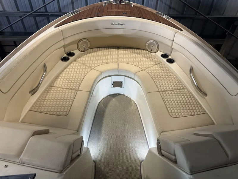 Slide: The Image of Luxurious interior of 2019 Chris-Craft Launch 28 GT boat with elegant seating and wood accents. - 8