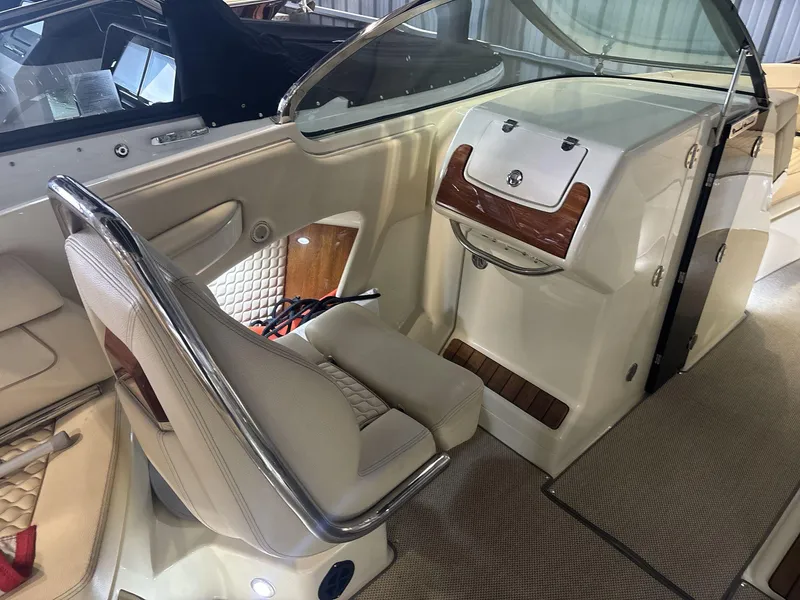 Slide: The Image of 2019 Chris-Craft Launch 28 GT interior with luxurious seating and elegant dashboard design. - 9