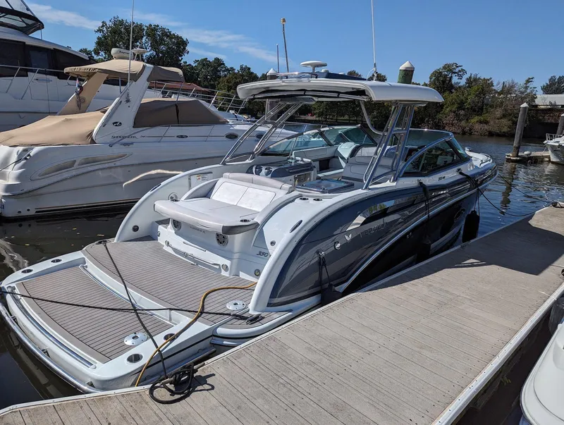 Slide: The Image of 2015 Formula 350 Crossover Bowrider docked at marina, sleek design, luxury features. - 1